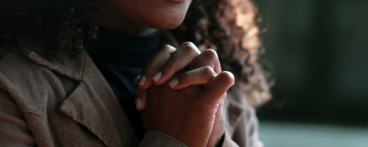 young woman praying for her dream