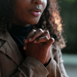 young woman praying for her dream